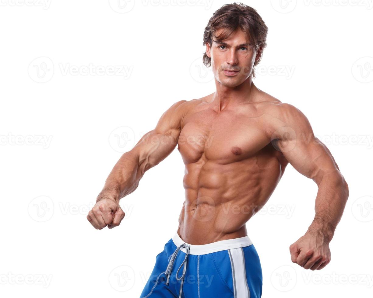 Handsome young muscular man on white background photo