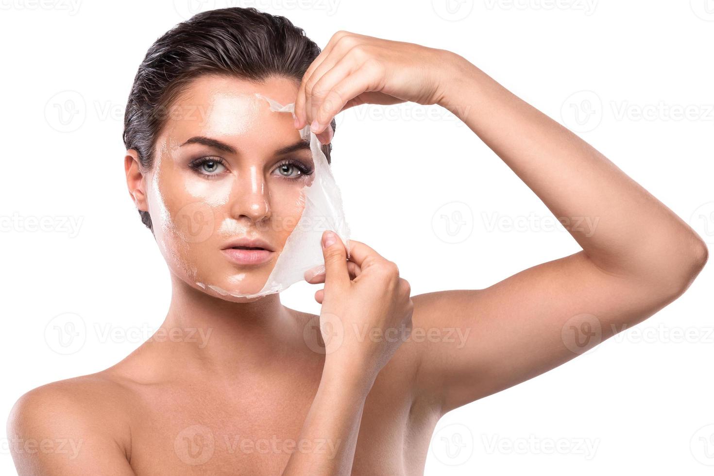Young woman with purifying Mask on her face photo