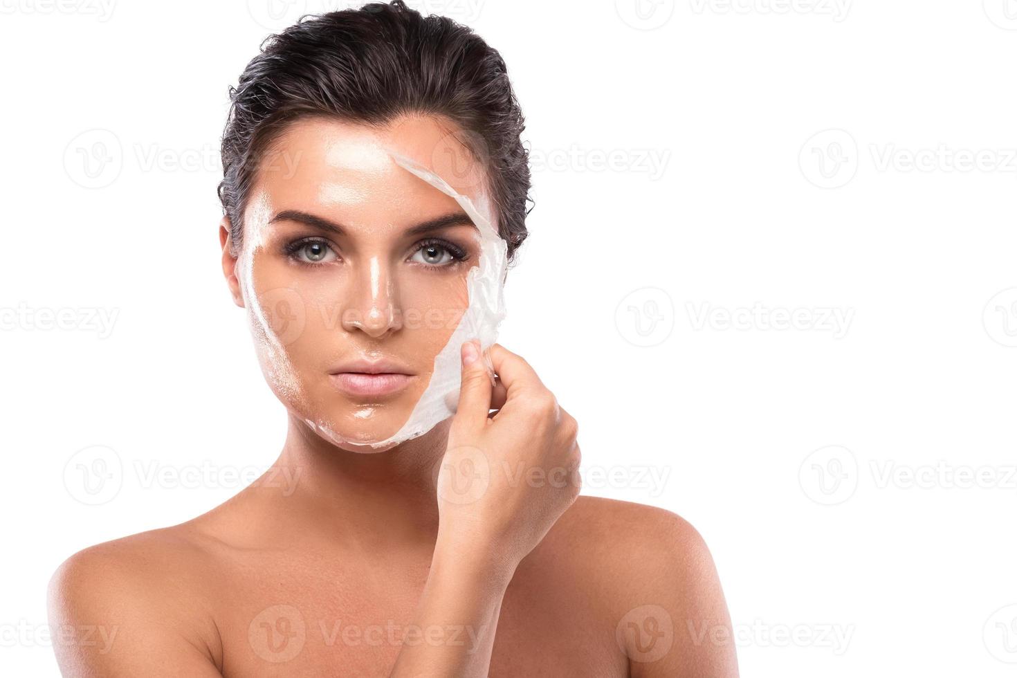 Young woman with purifying Mask on her face photo