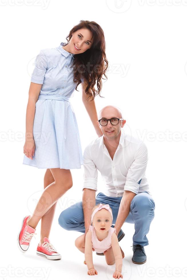 Young and happy family. Parents with her cute daughter. photo