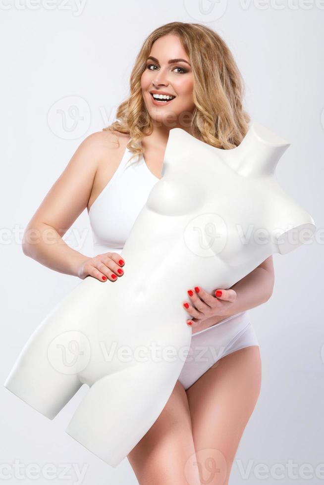 Plus size model and dummy female torso photo