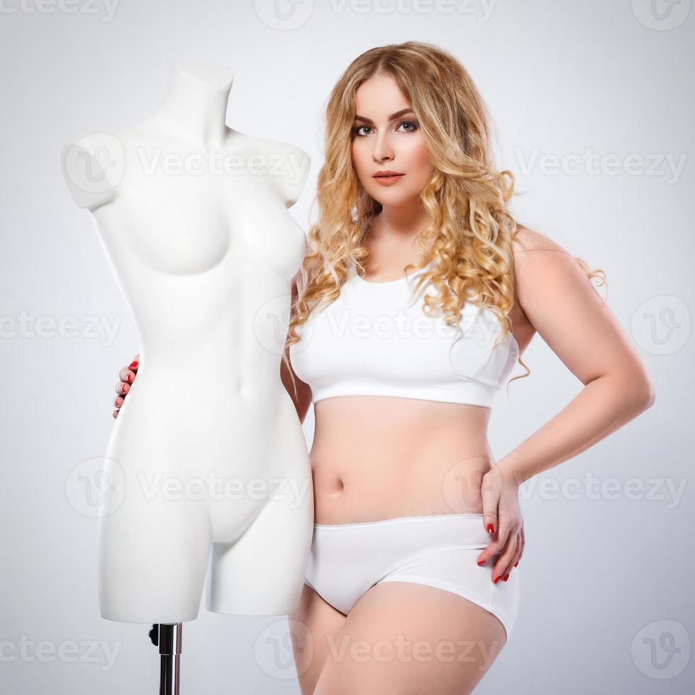 Plus size model and dummy female torso photo