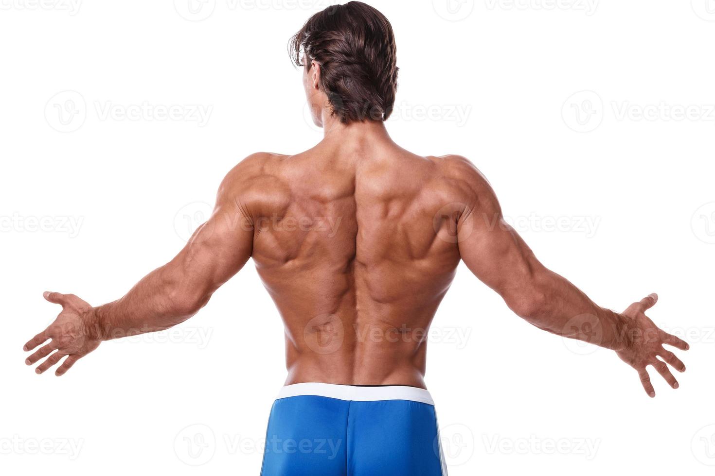 Handsome young muscular man on white background photo