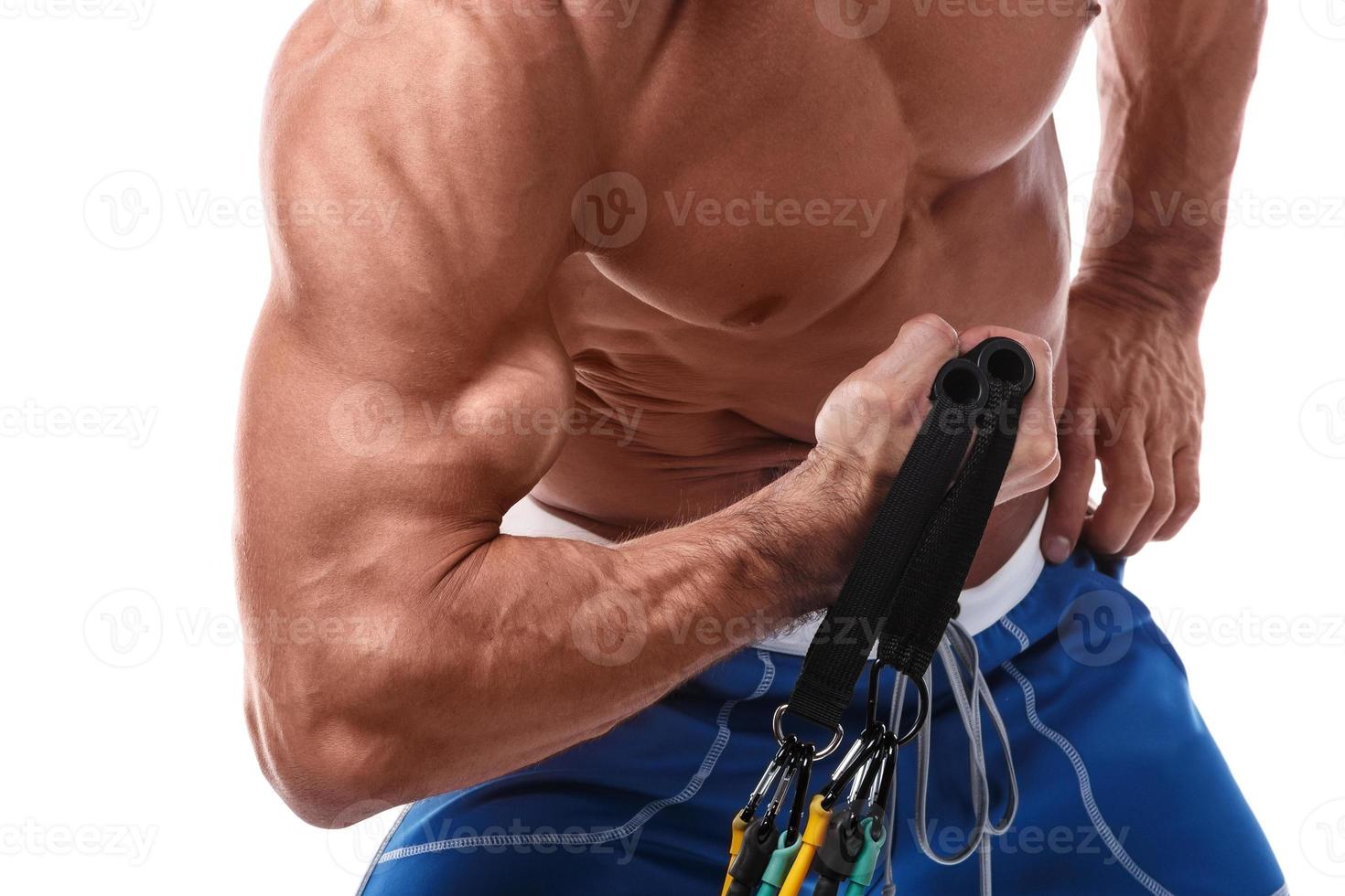 Muscle man working out with rubber band photo