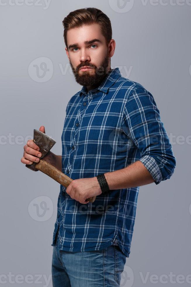 Portrait of handsome bearded man in checkered shirt photo