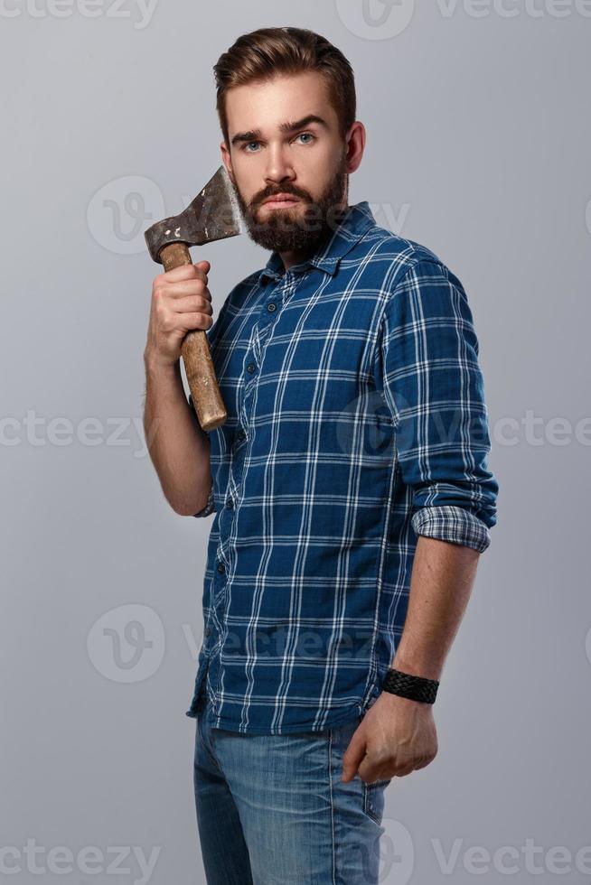 Portrait of handsome bearded man in checkered shirt photo