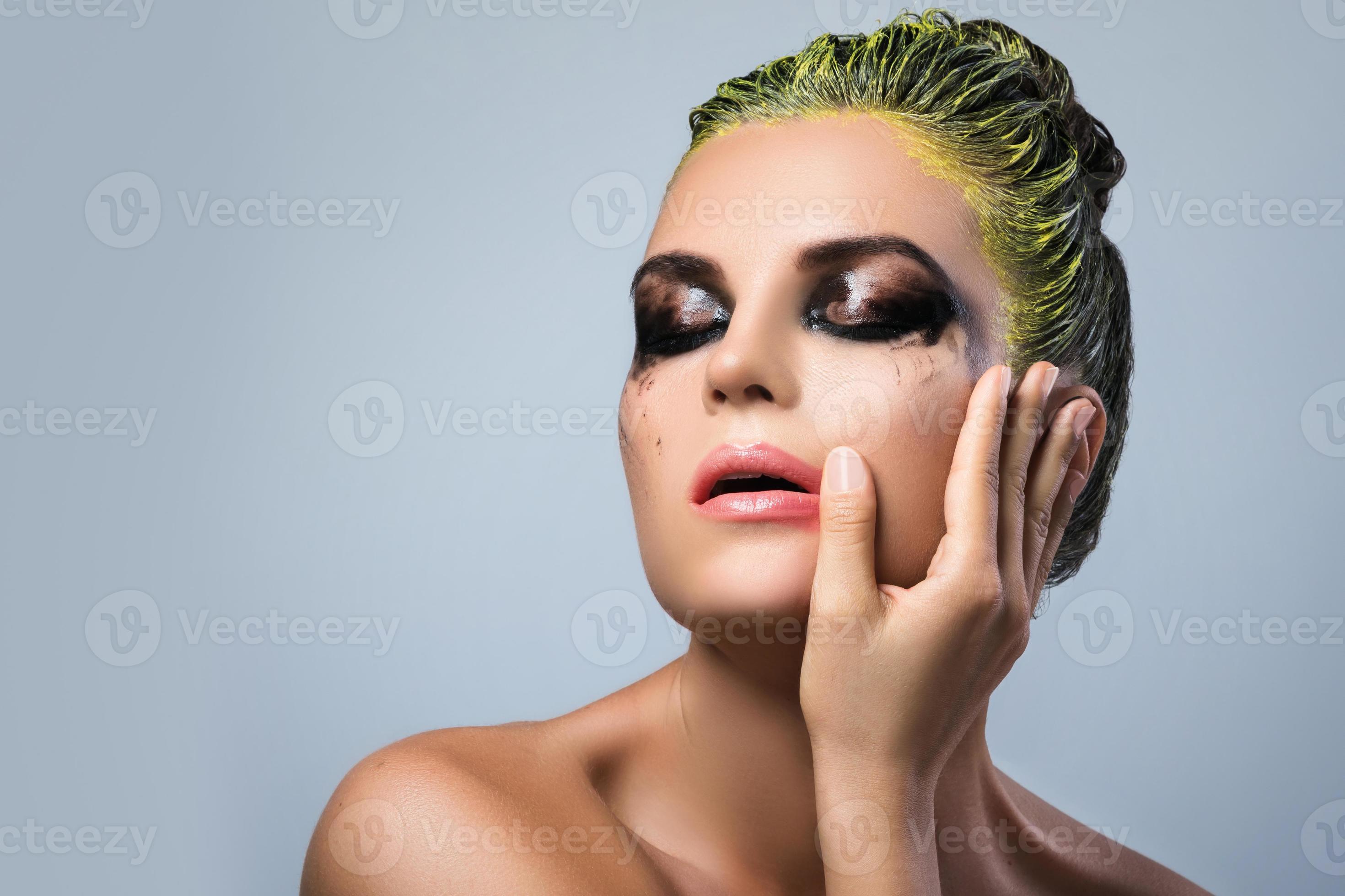 Woman with wet eyeshadows and yellow hair 16114541 Stock Photo at Vecteezy