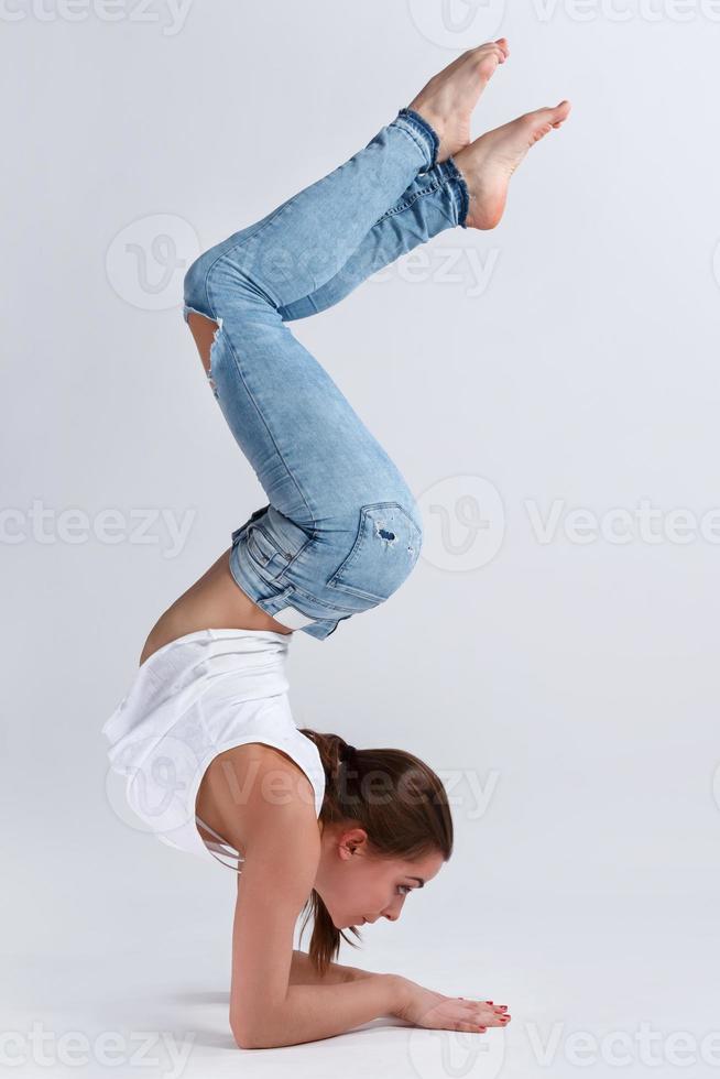 Female dancer during handstand photo