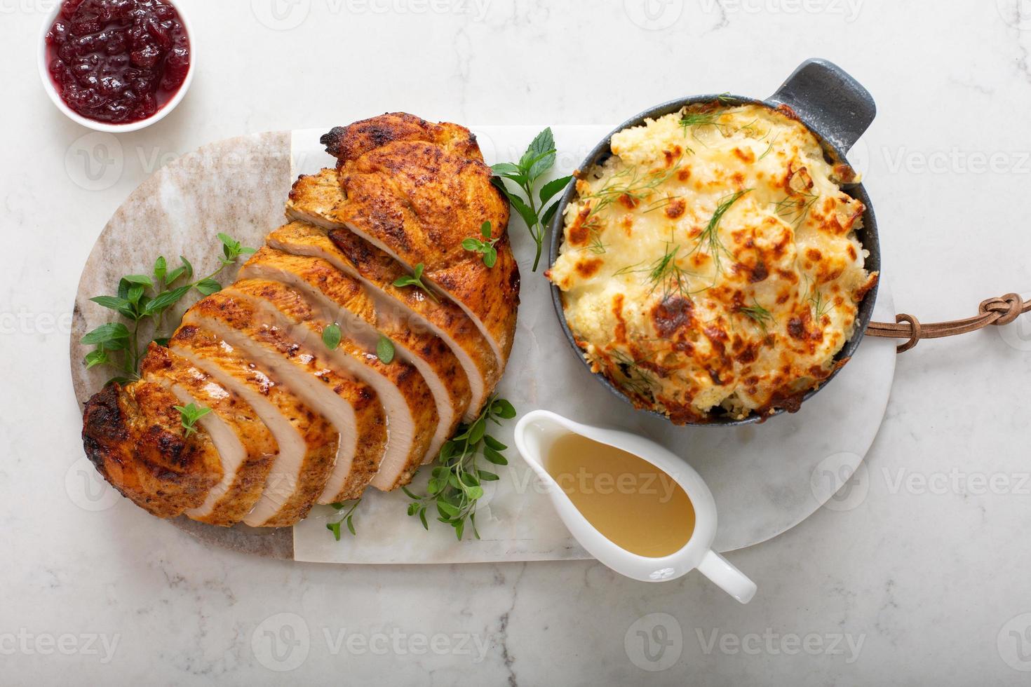 Roasted turkey breast sliced on a plate for holidays photo