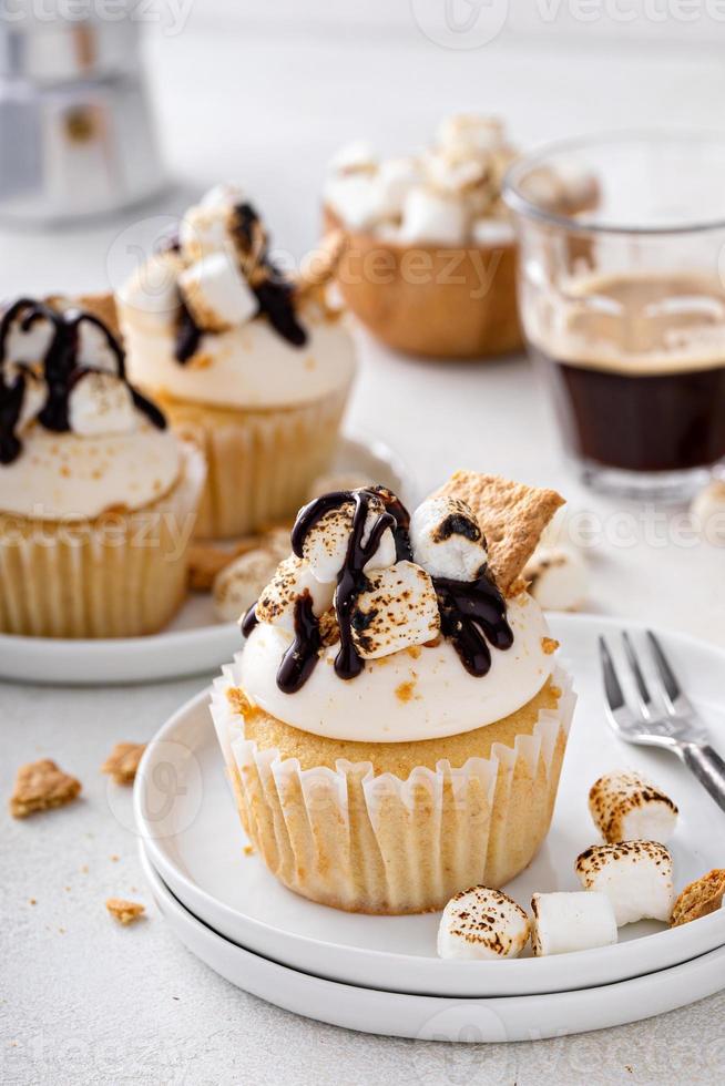 Smores cupcakes with graham crackers, toasted marshmallows and chocolate photo