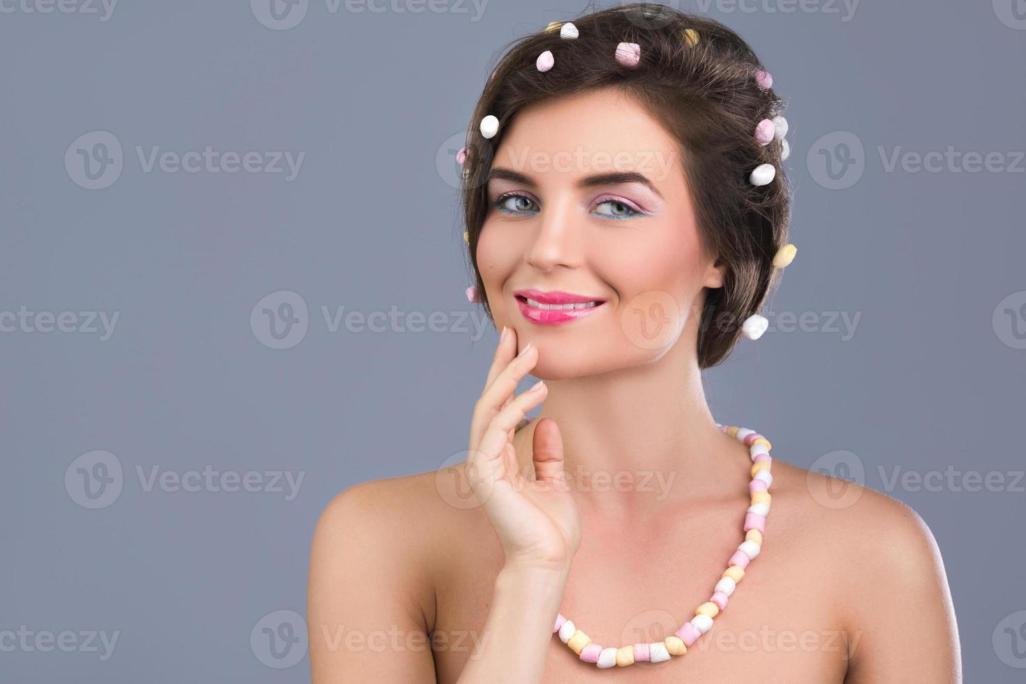 Beautiful woman with creative hairstyle made from marshmallow photo