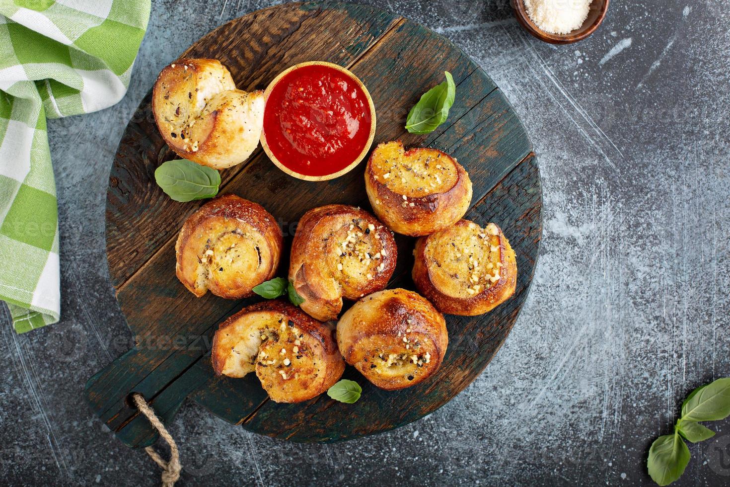 Garlic dinner rolls with marinara sauce photo