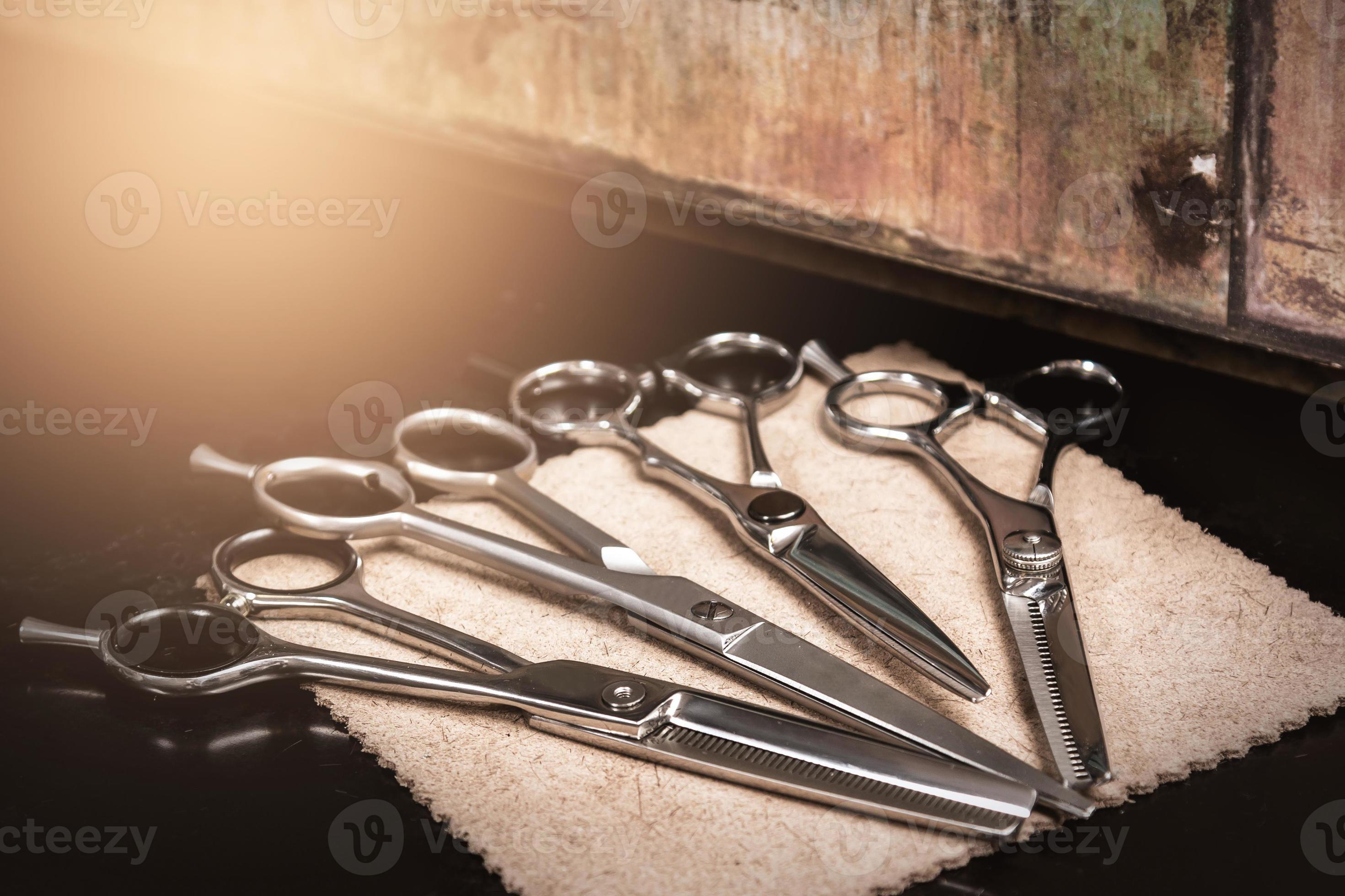 Different hairdresser scissors 16115205 Stock Photo at Vecteezy