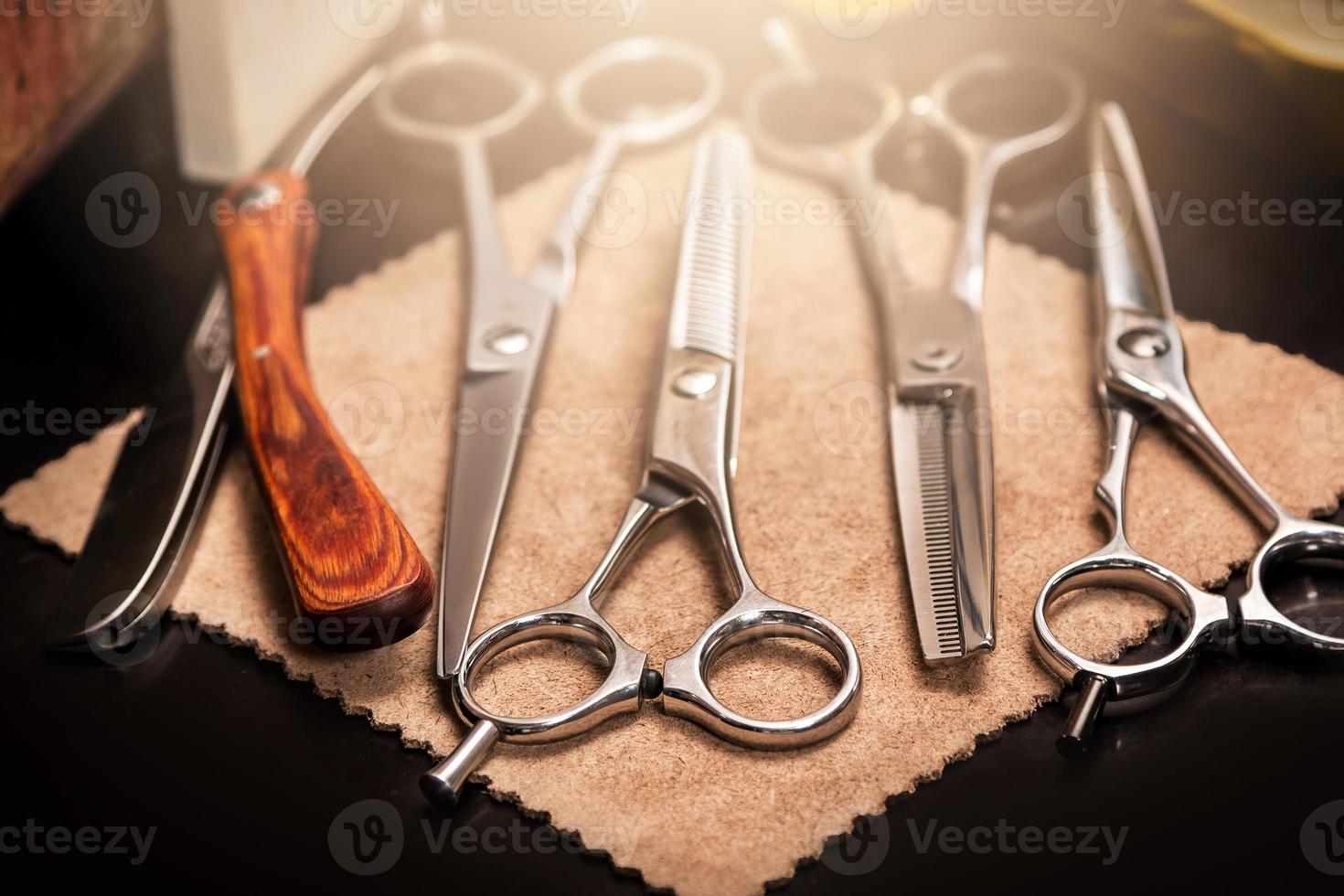 Straight razor and different scissors photo