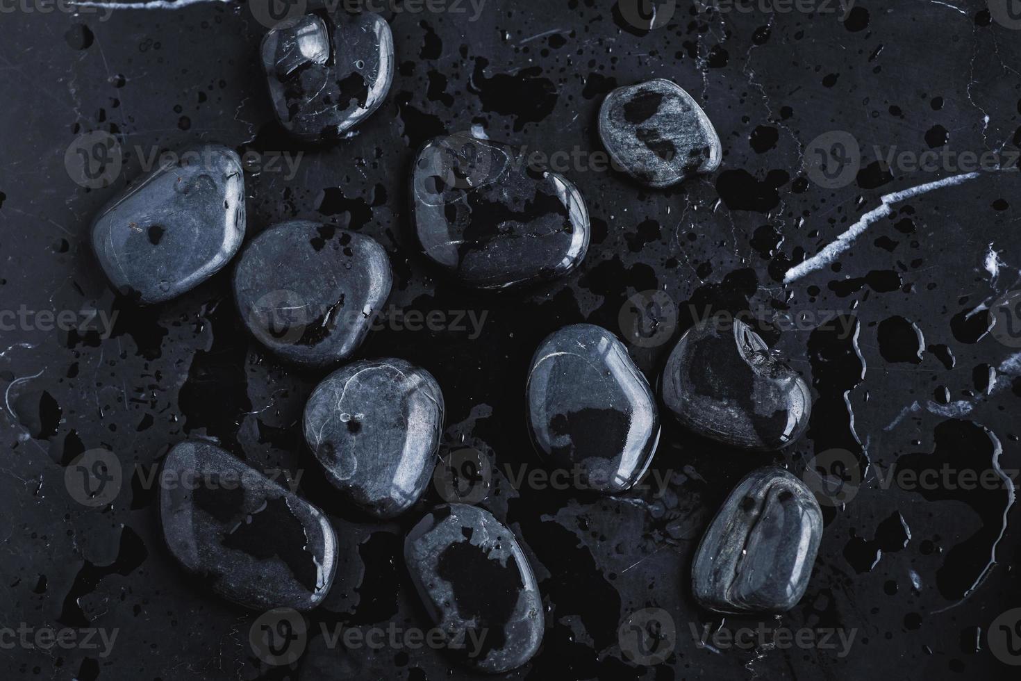 Closeup of black hot rocks for stone massage photo