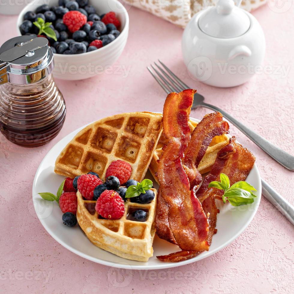 Belgian waffles with bacon and fresh berries for breakfast photo