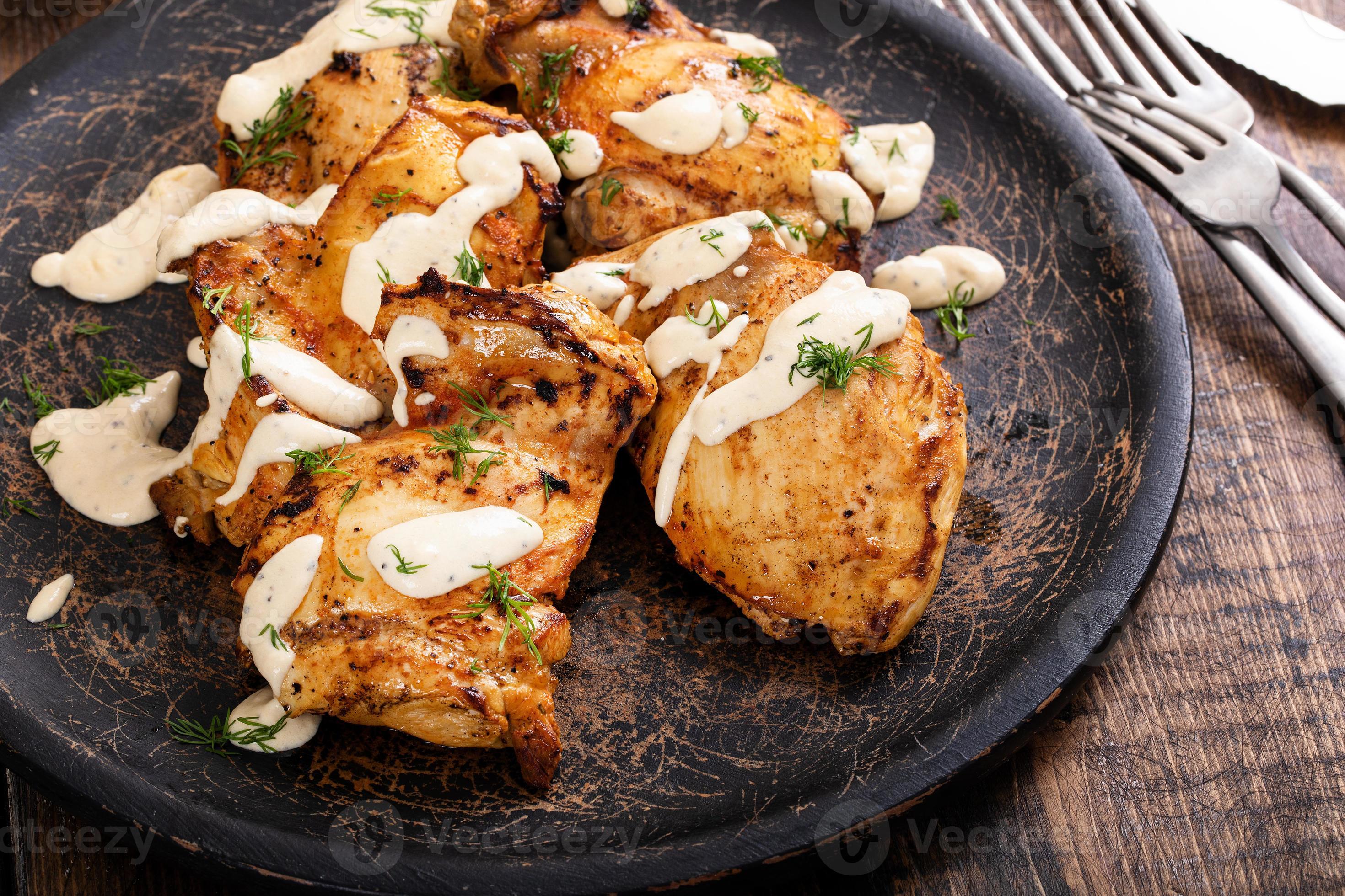 Roasted chicken thighs with dill pickle sauce 16116617 Stock Photo at