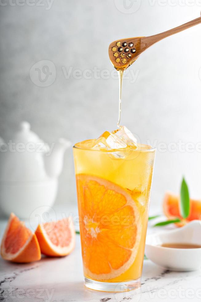 Grapefruit honey jasmine tea served cold with ice photo