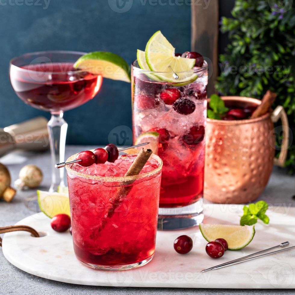 Variety of festive Christmas cocktails with cranberry and lime photo