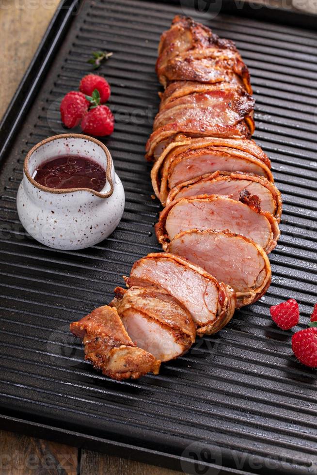 Pork tenderloin wrapped in bacon with raspberry vinaigrette photo