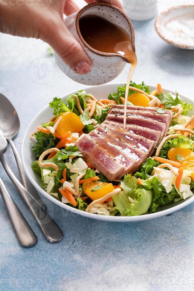 Seared tuna with asian crunchy salad with oranges photo