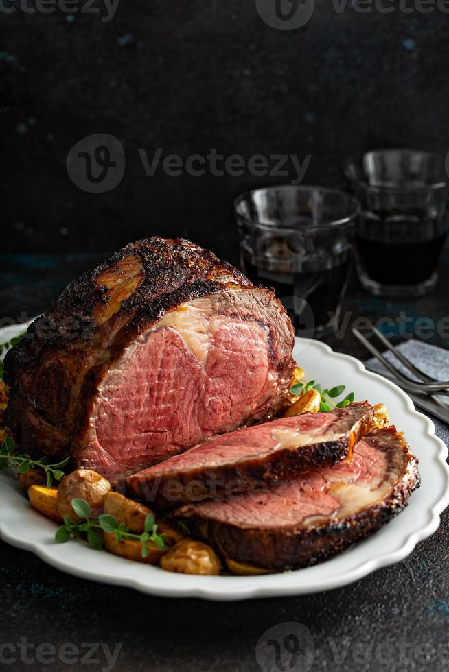 Prime rib roast sliced for celebration dinner photo