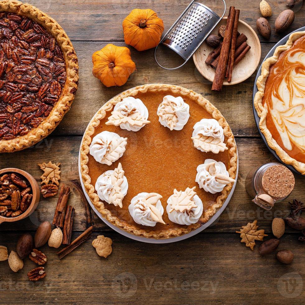 Traditional fall Thanksgiving pies, pumpkin and pecan pie photo