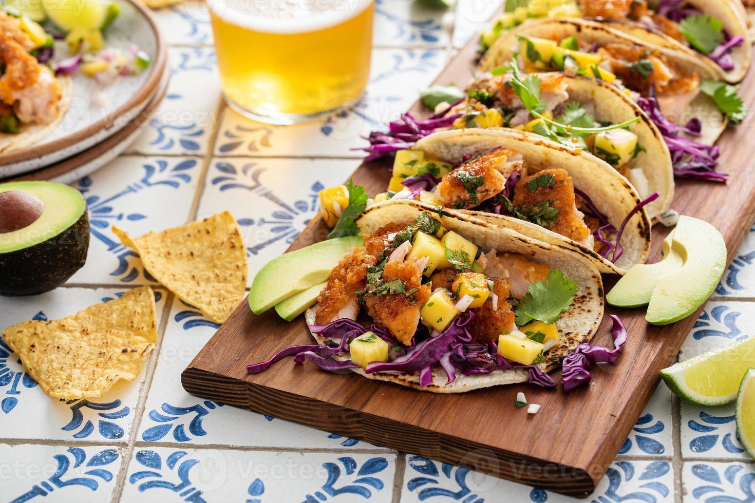 Fish tacos with mango salsa and red cabbage photo