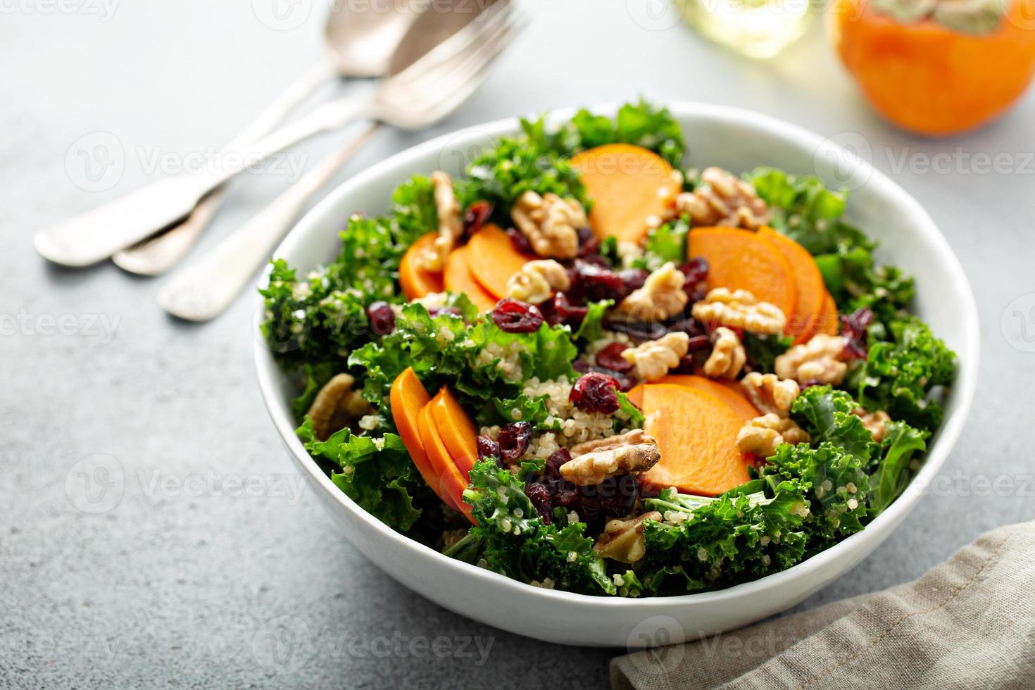 Fall salad with kale, walnuts and persimmon photo