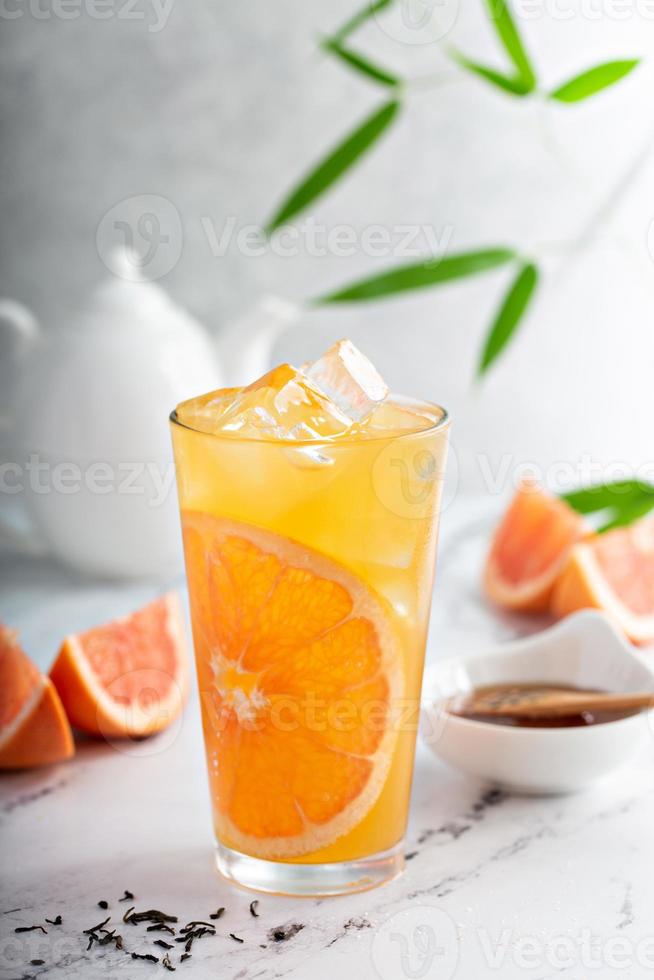 Grapefruit honey jasmine tea served cold with ice photo