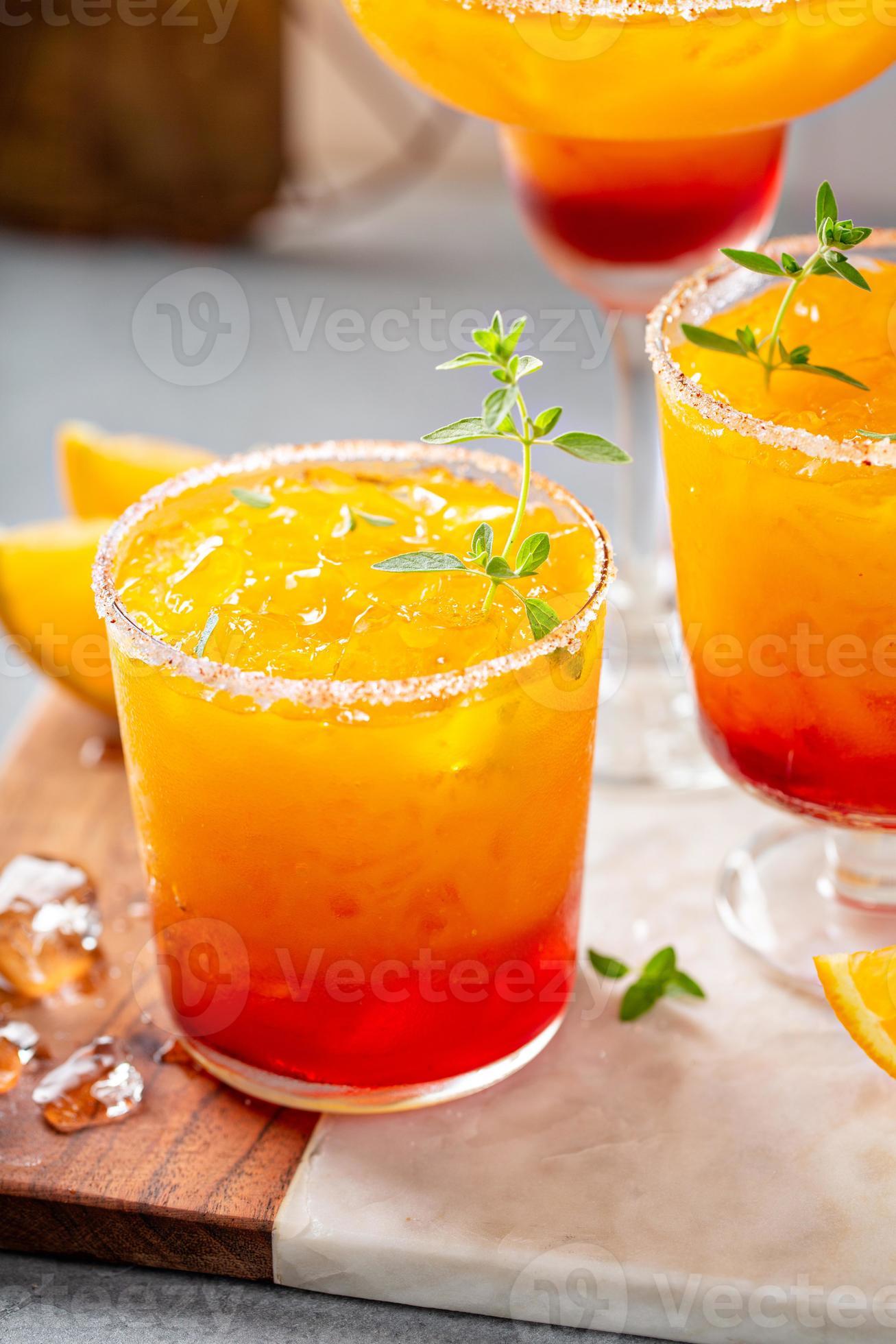 Tequila sunrise margarita cocktail with ice, refreshing drink 16117099