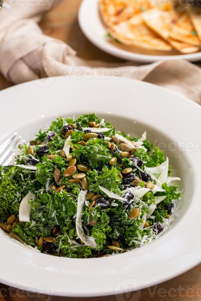 Fall kale salad with fennel and pumpkin seeds photo
