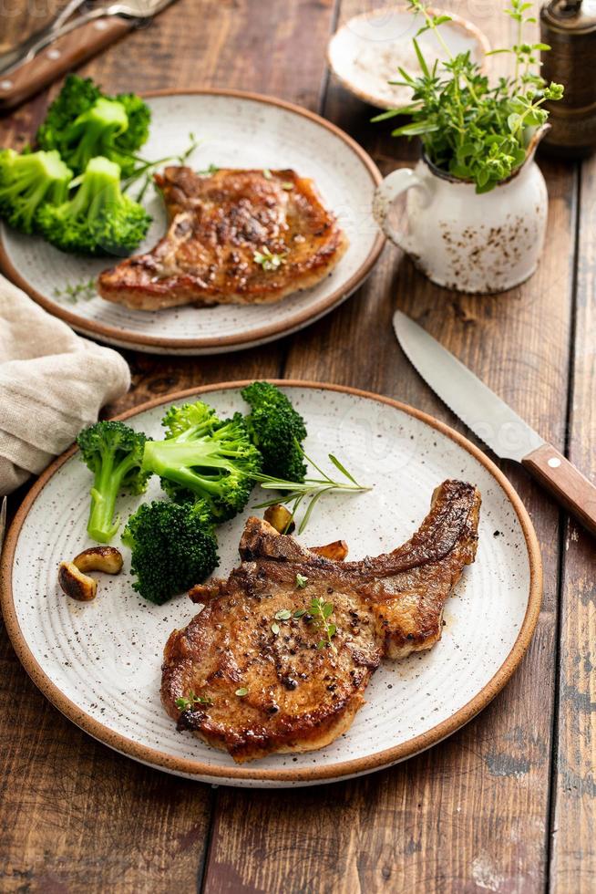 Grilled or pan fried pork chops on the bone photo