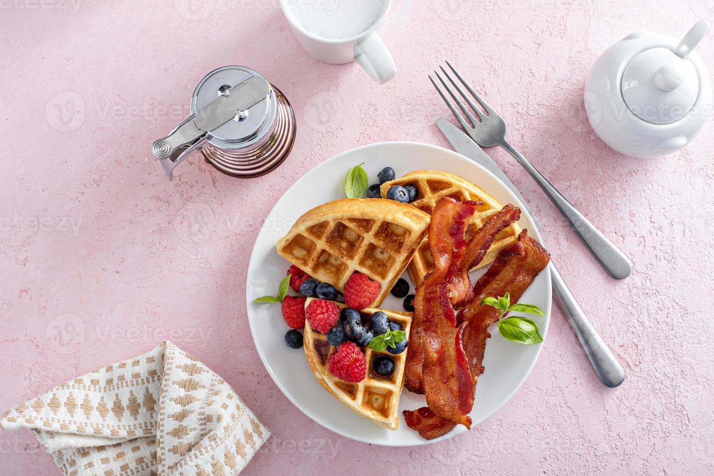 Belgian waffles with bacon and fresh berries for breakfast photo
