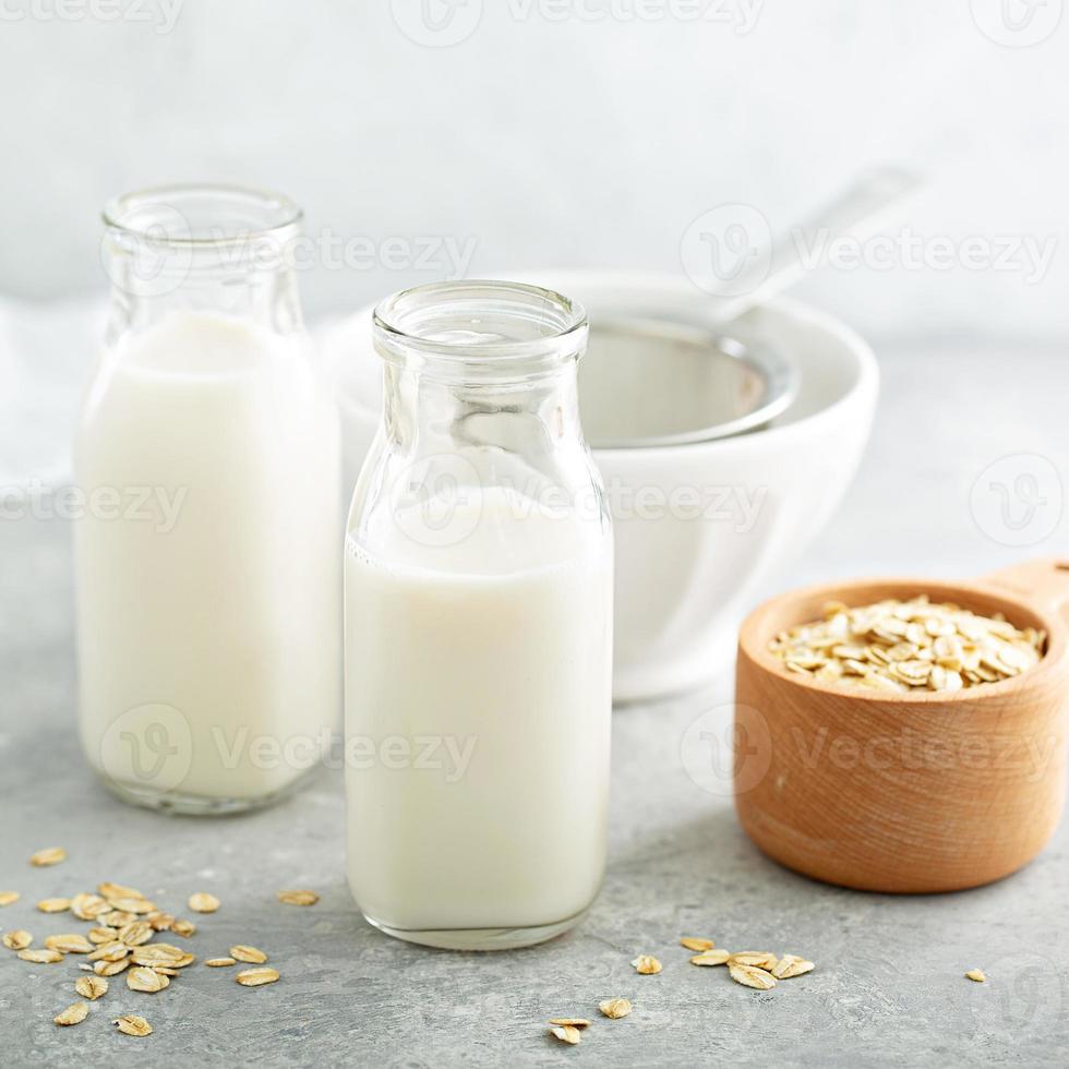 Oat milk in glass bottles photo