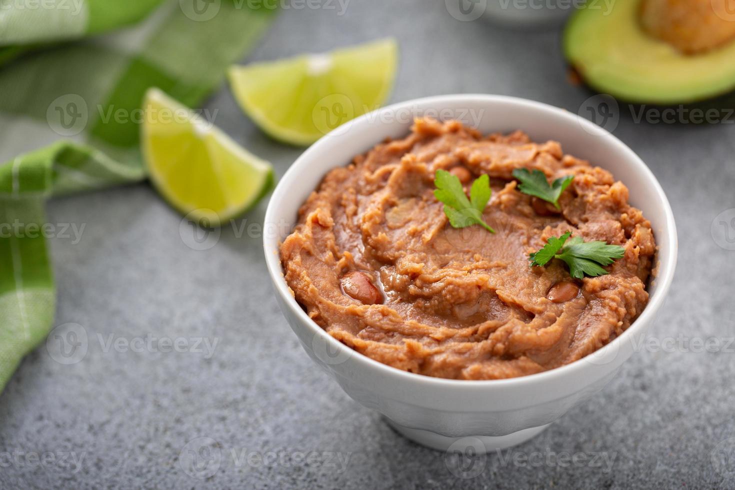 Refried beans in a white bowl photo