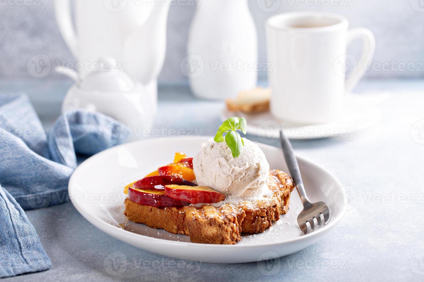 French toast with peaches and vanilla ice cream photo