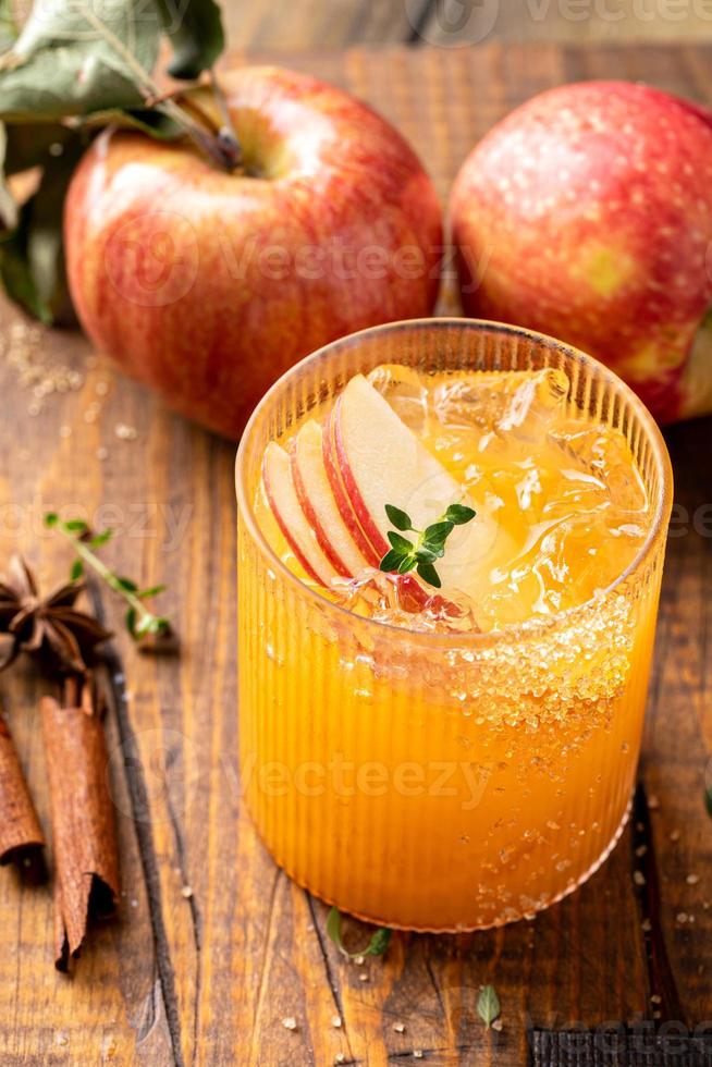 Apple cider margarita with apple slices and fresh thyme photo