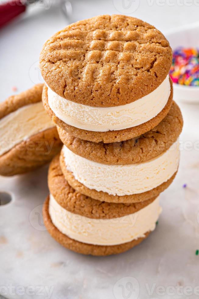 Ice cream and cookies sandwiches stacked on the table photo
