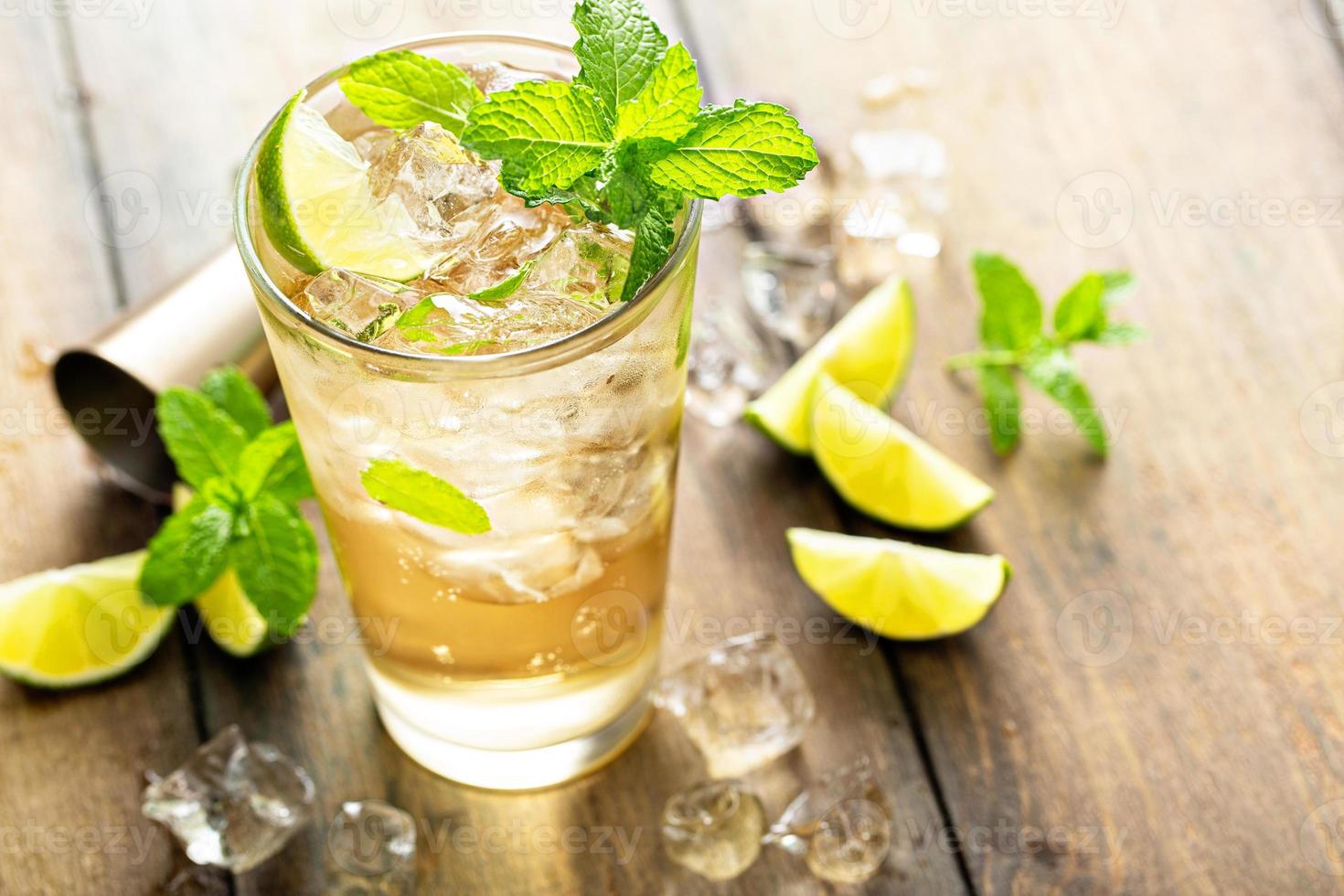 Refreshing summer cocktail with ginger beer and lime photo