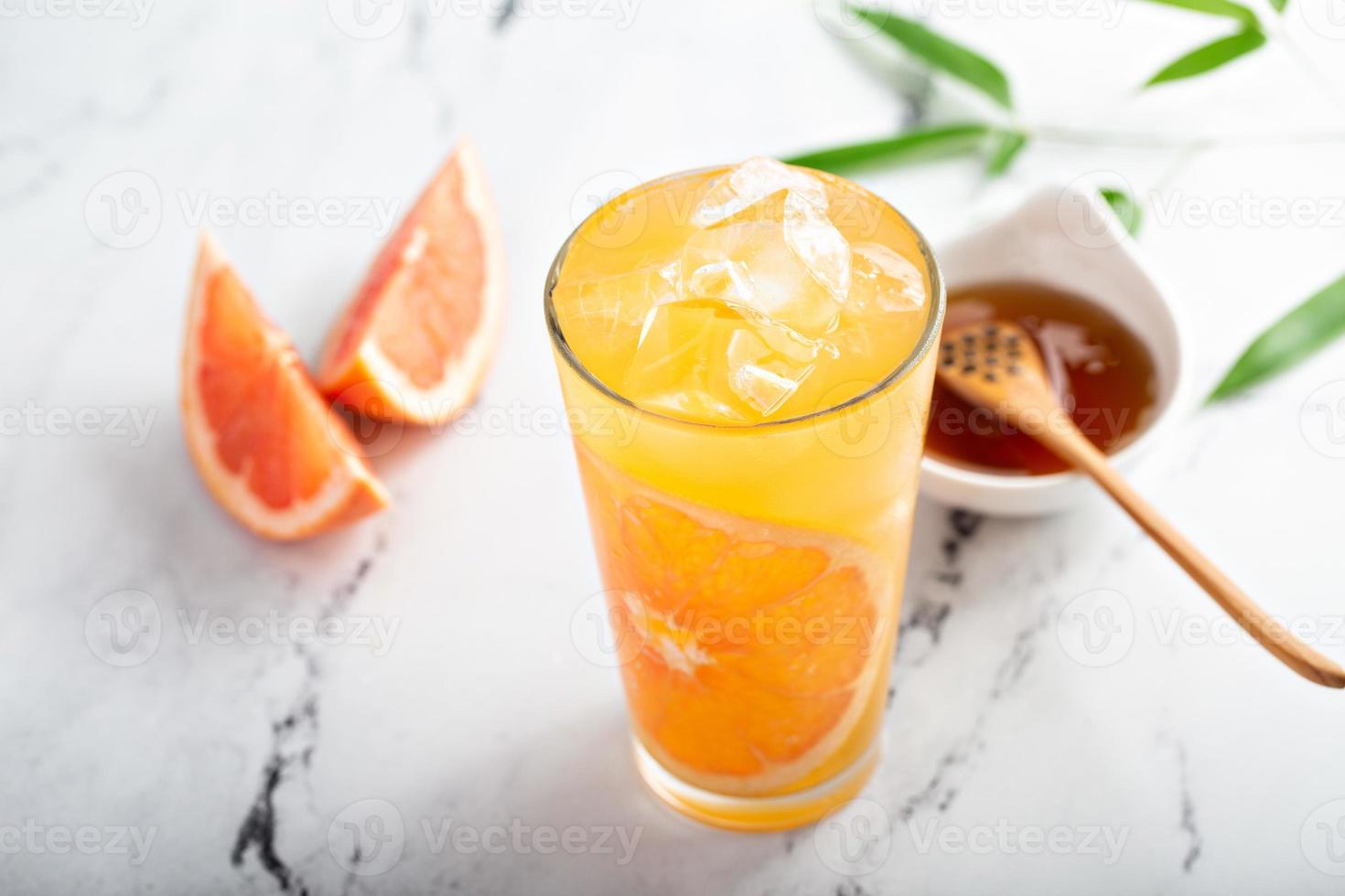 Grapefruit honey jasmine tea served cold with ice photo