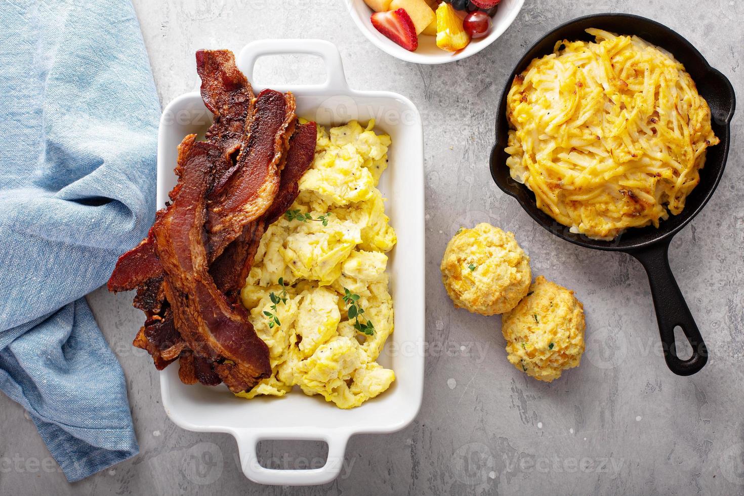 Full breakfast with scrambled eggs, bacon and potatoes photo
