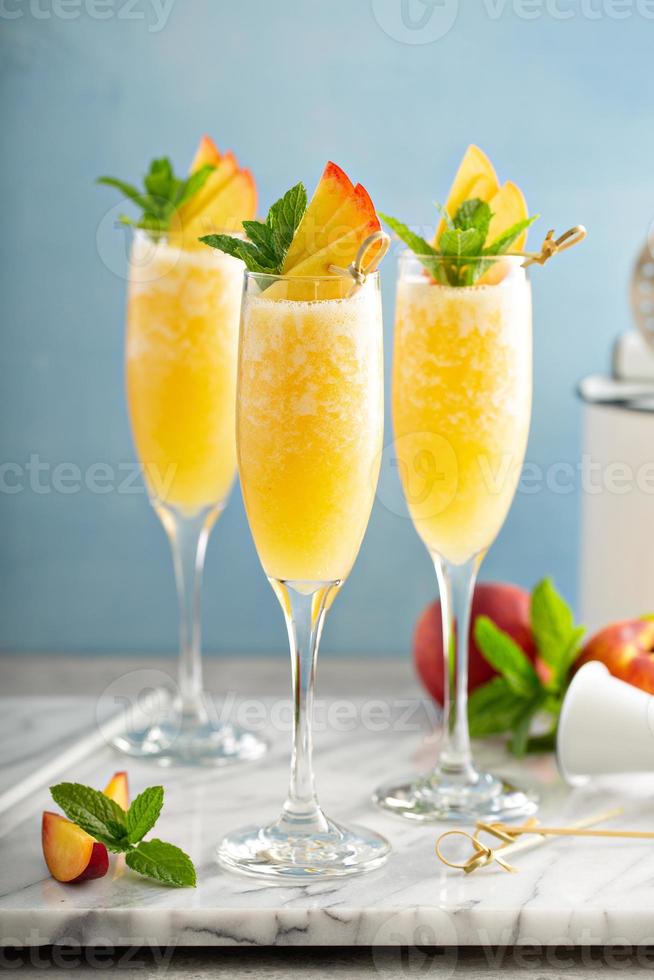 Summertime peach mimosas or bellinis photo