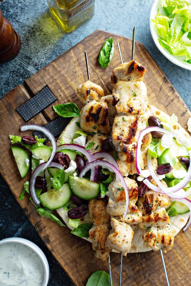 Chicken kebabs on a pita photo