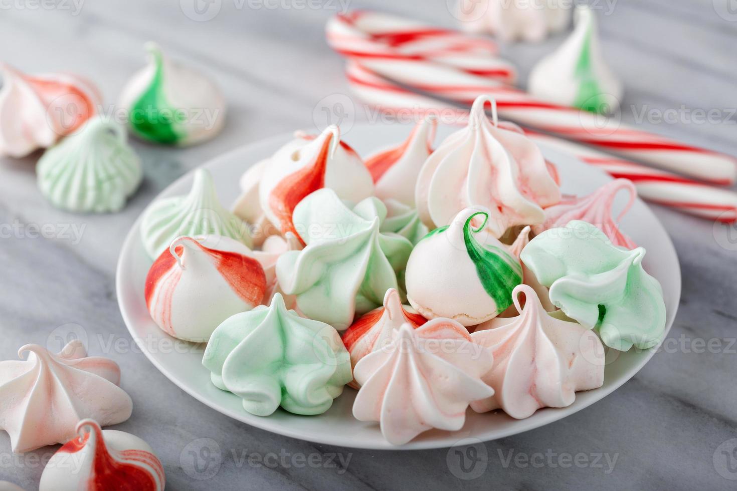 Peppermint meringues on a marble table, Christmas treat photo