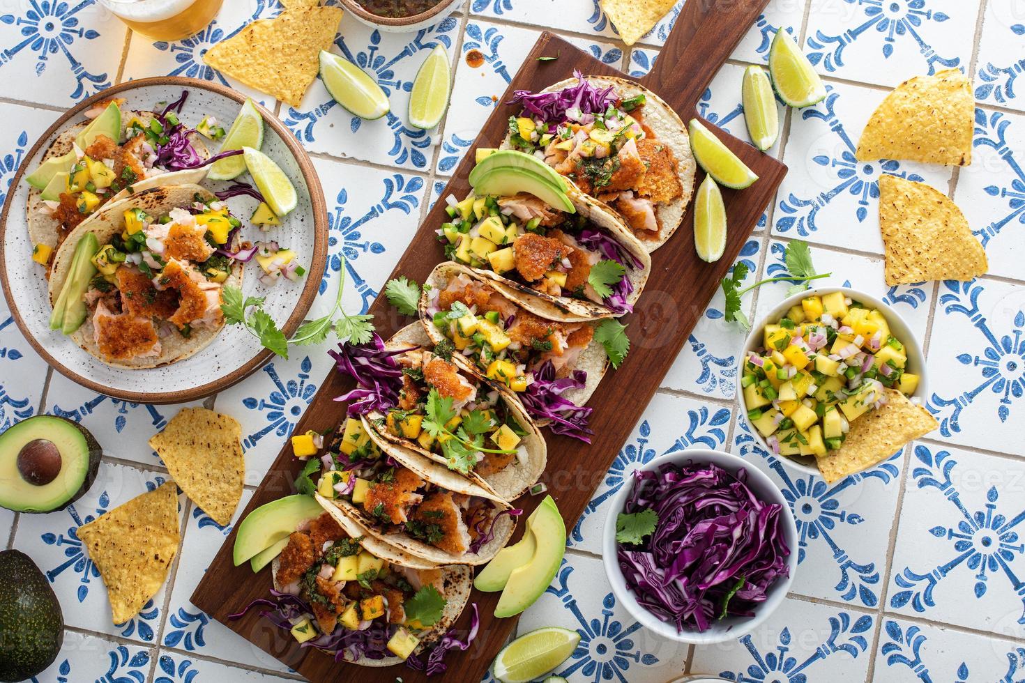 Fish tacos with mango salsa and red cabbage photo