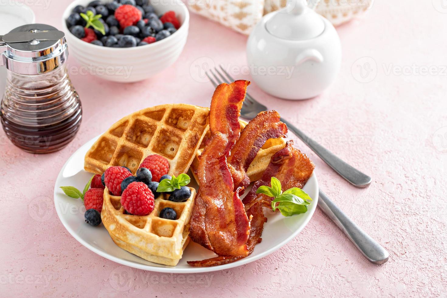 Belgian waffles with bacon and fresh berries for breakfast photo