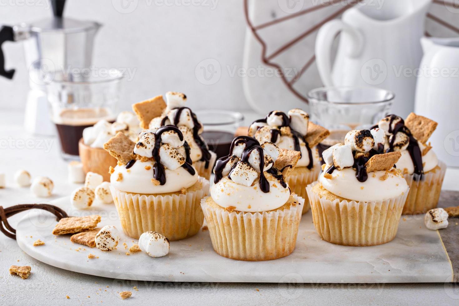 Smores cupcakes with graham crackers, toasted marshmallows and chocolate photo