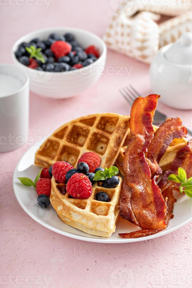 Belgian waffles with bacon and fresh berries for breakfast photo