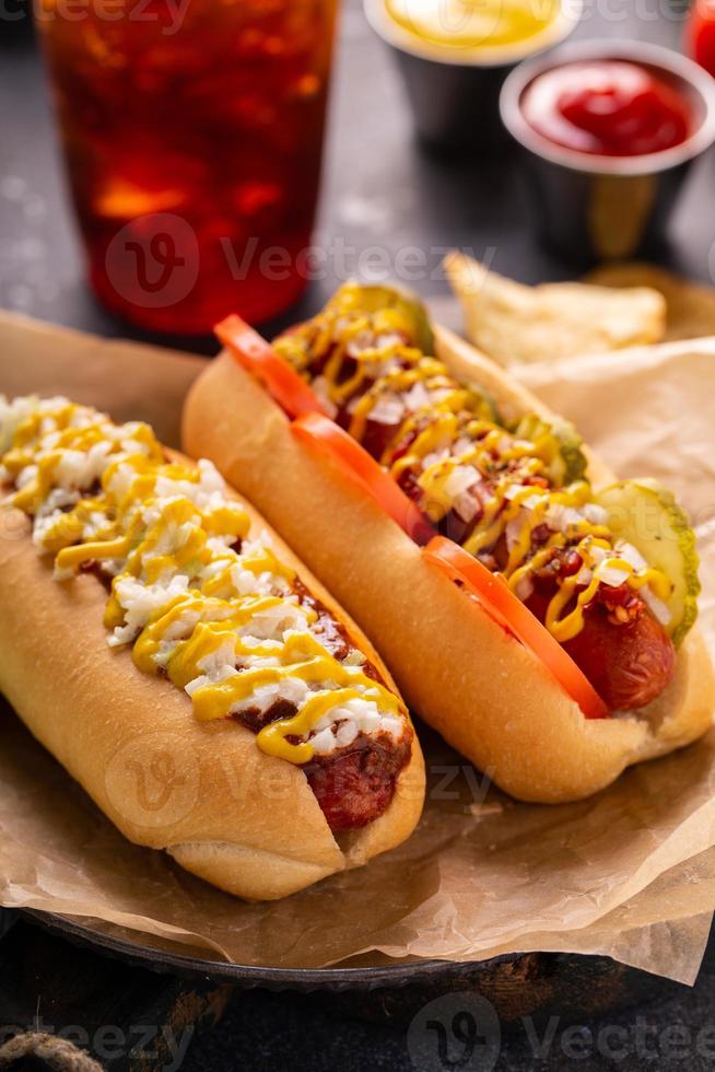 Two hot dogs with ketchup and mustard photo